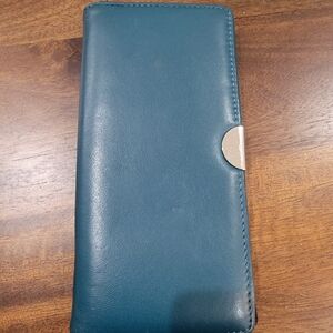 Blue Vegan Leather Wallet with Multiple Pockets and Magnetic Closure.